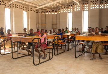 Malawian children start in a school built by 14Trees’ 3D printer