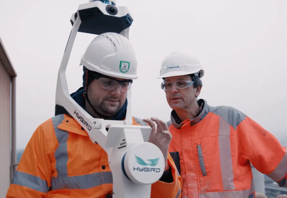 Holcim digital twin Switzerland plant_two men testing equipment