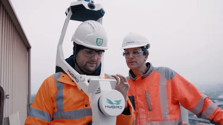 Holcim digital twin Switzerland plant_two men testing equipment