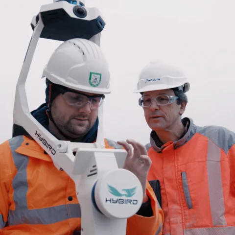 Holcim digital twin Switzerland plant_two men testing equipment